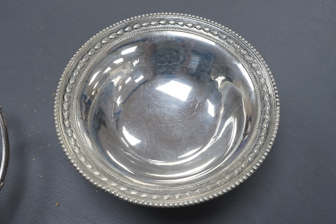 A George V demi-fluted silver cream jug, by William Hutton & Sons Ltd, Sheffield, 1922, height 98mm, together with a smaller silver ream jug, a small silver pedestal bowl and a late Victorian silver Anglo-Indian sugar bo